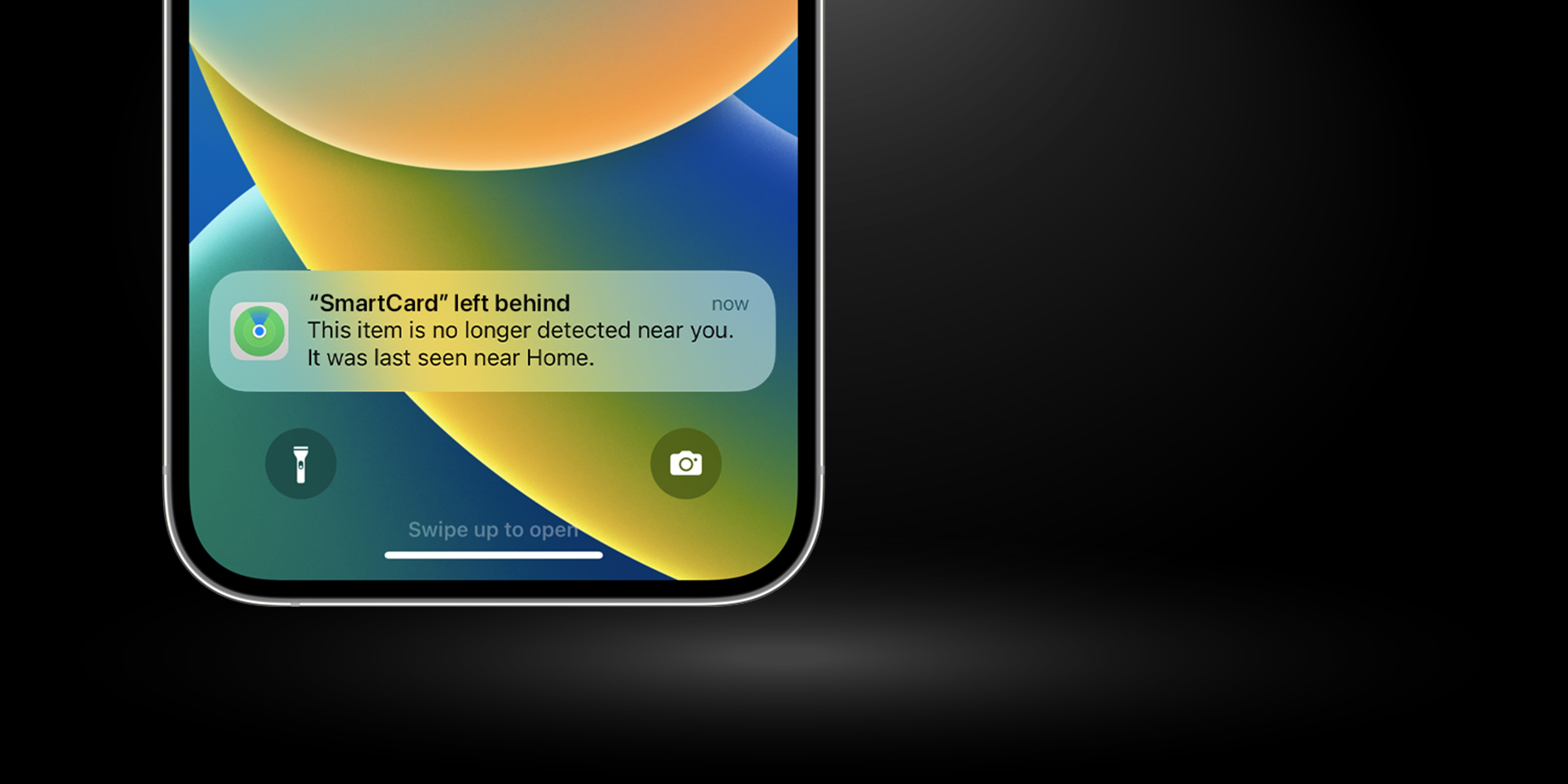 SmartCard by KeySmart shown alongside smartphone and Qi wireless charging case