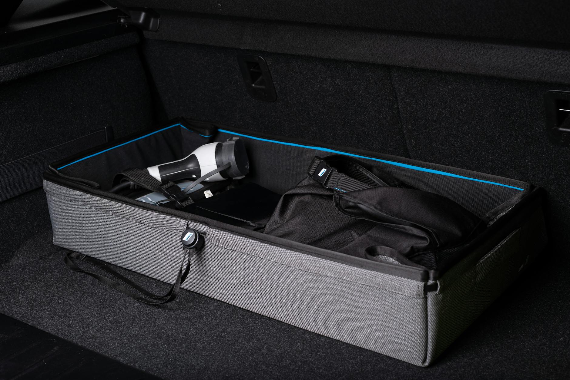 Organized Road Trip Gear in Car Trunk Organized car trunk with storage boxes and road trip gear packed neatly