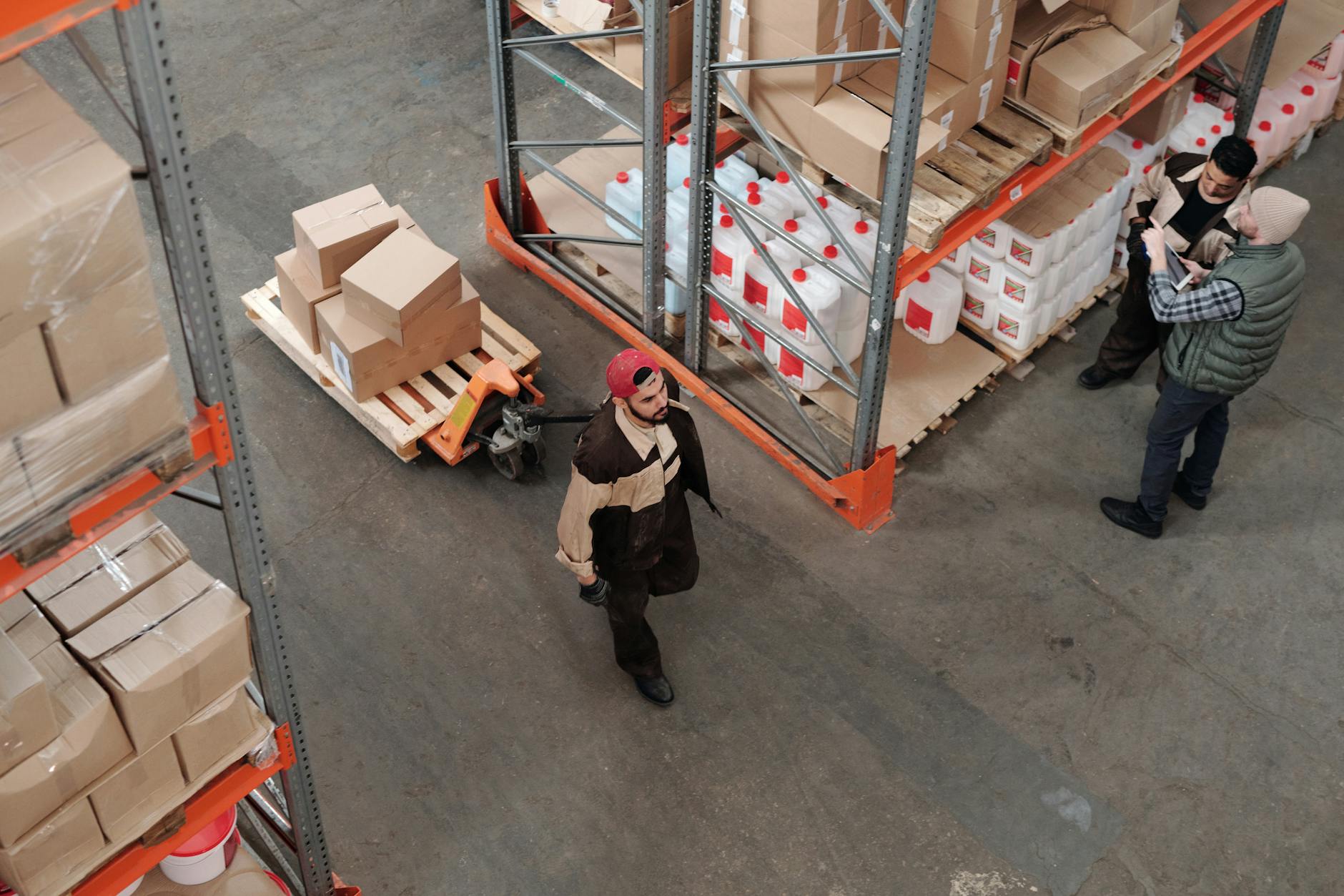 Prolonged Standing on Hard Floors — Health Effects Over Time Warehouse workers standing for long hours on hard floors during a shift