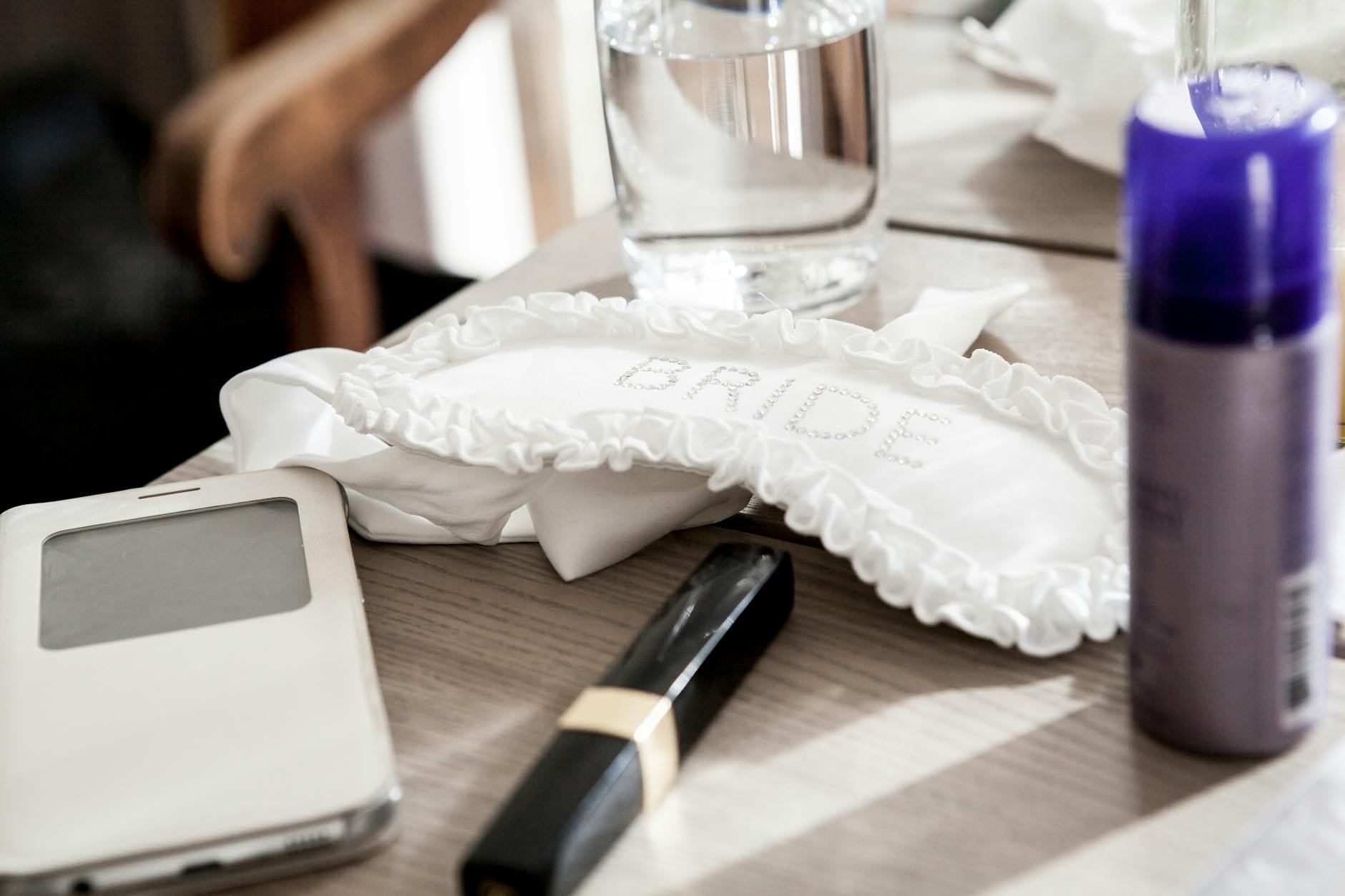 Wedding preparation beauty items including makeup and personal care products laid out on a table