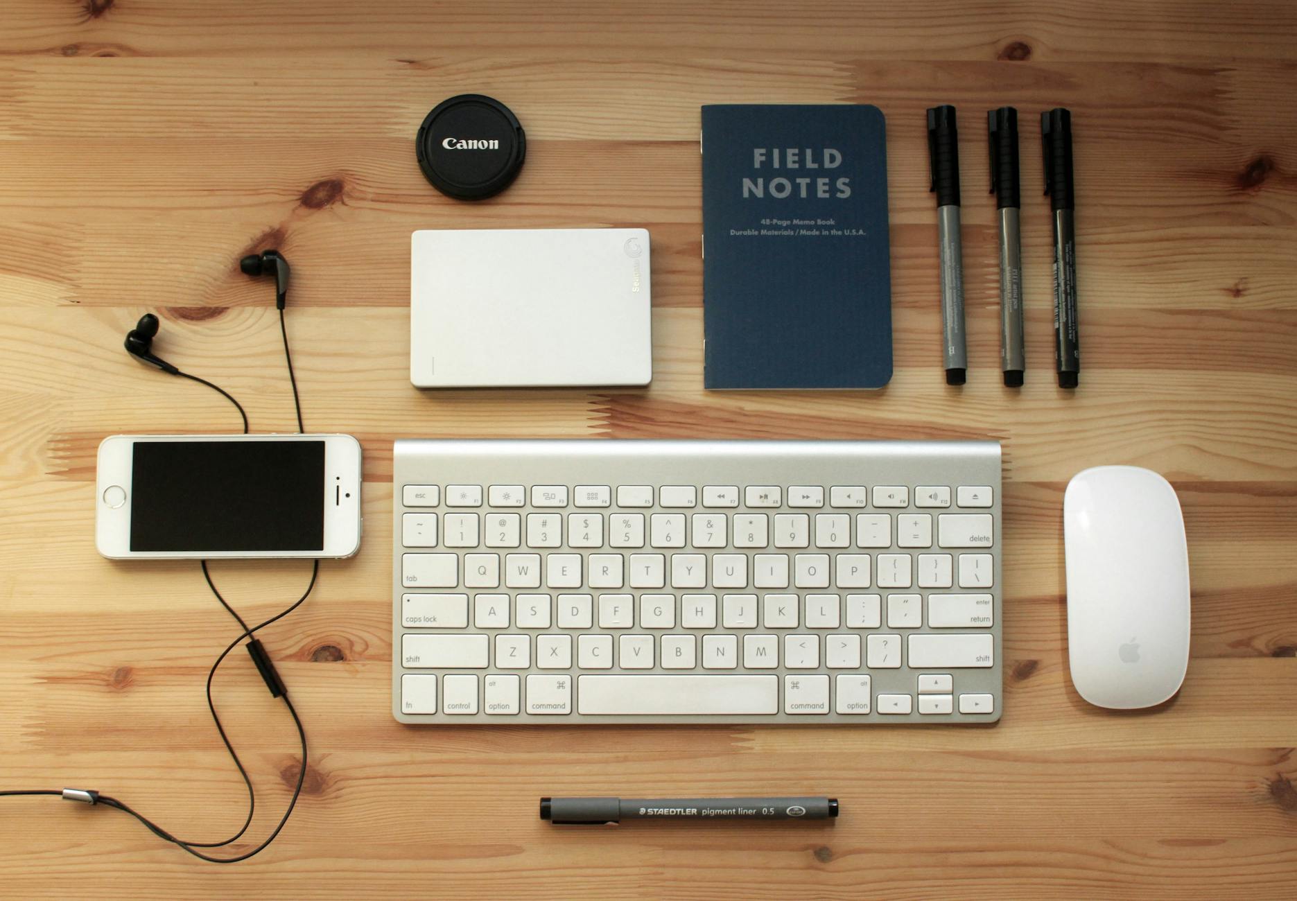 Electronics and gadgets laid out on a desk — planning a tech packing list for international travel 2026