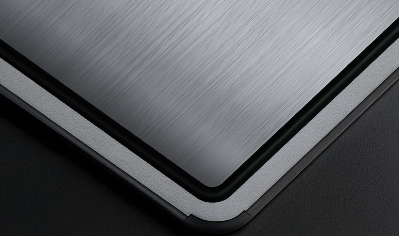 Close-up of the TIBO titanium cutting board surface texture showing non-porous medical-grade material