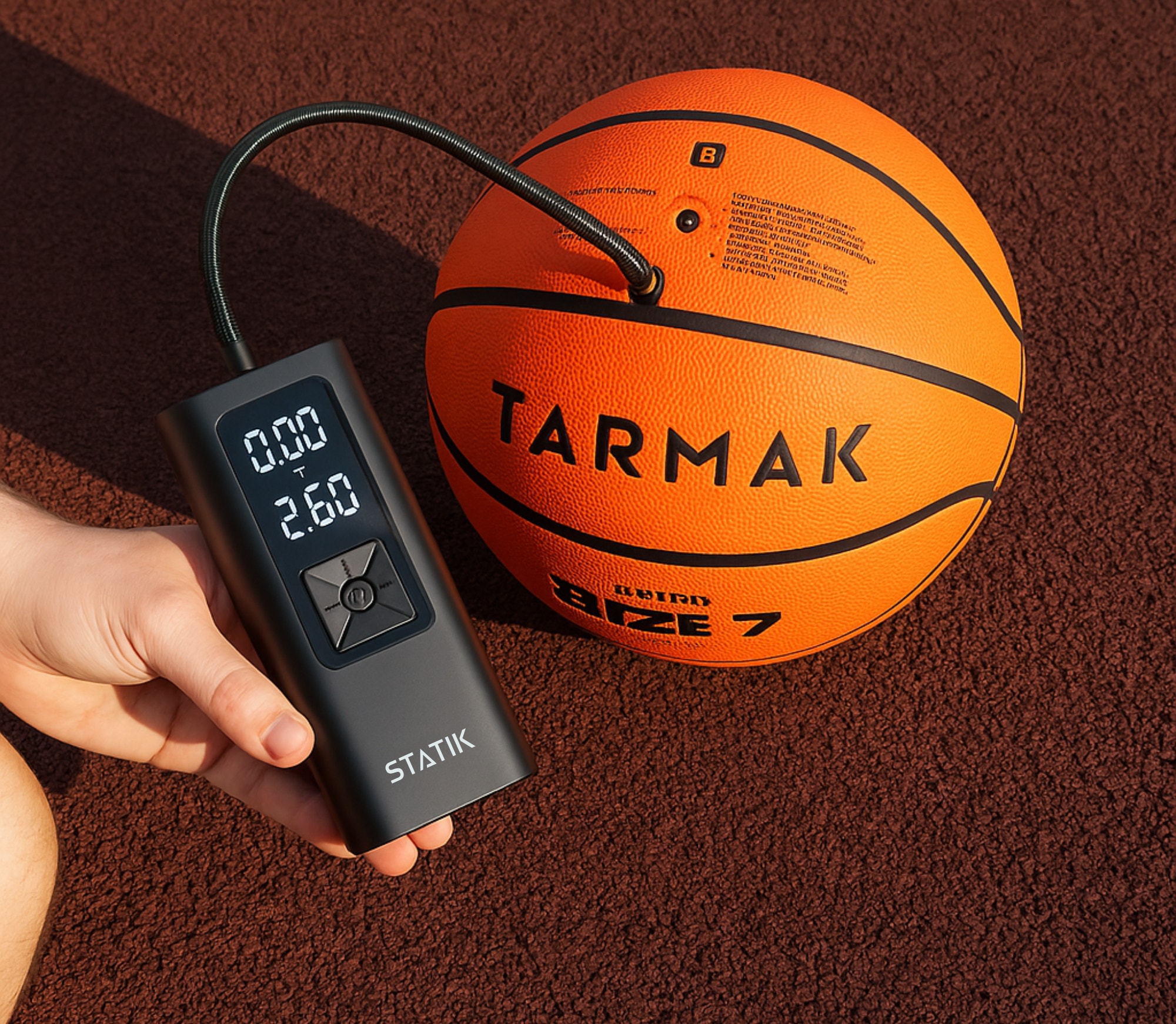 TireHero wireless tire inflator held in hand showing compact size