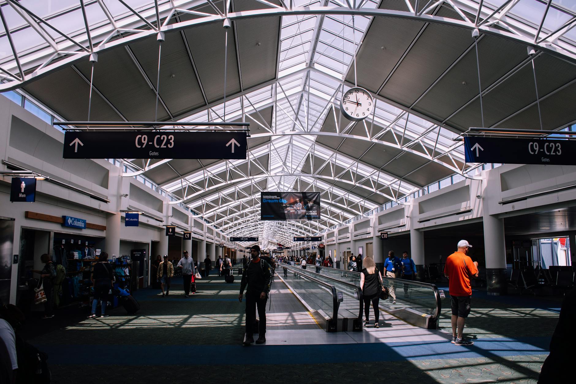 Airport Travel Tech 2026 - TSA Electronics Rules Modern airport terminal with travelers navigating security and transit areas