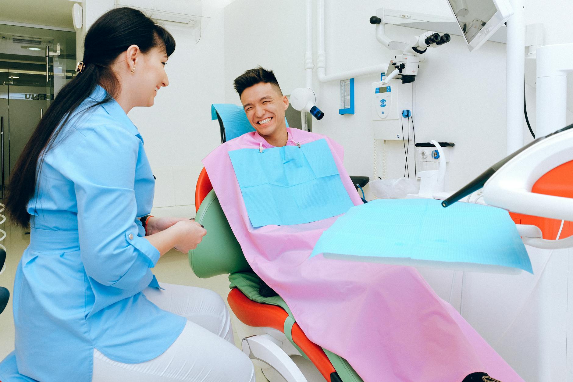 Dentist and patient during a friendly consultation about cosmetic dentistry options