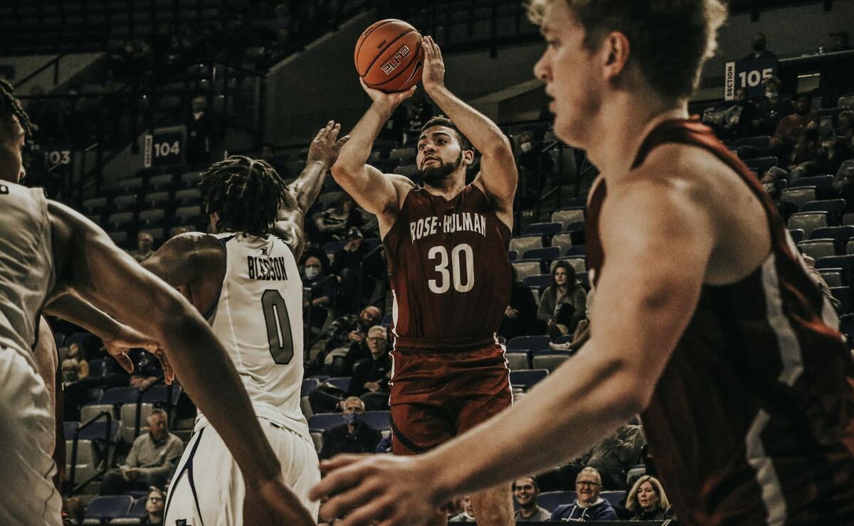 College basketball players competing in an intense NCAA tournament game
