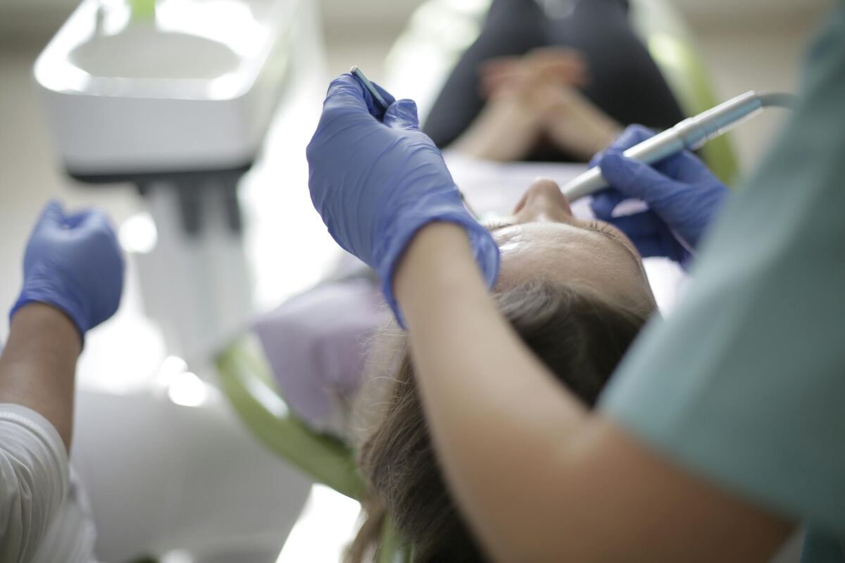 Dentist examining a patient's teeth in a modern dental clinic