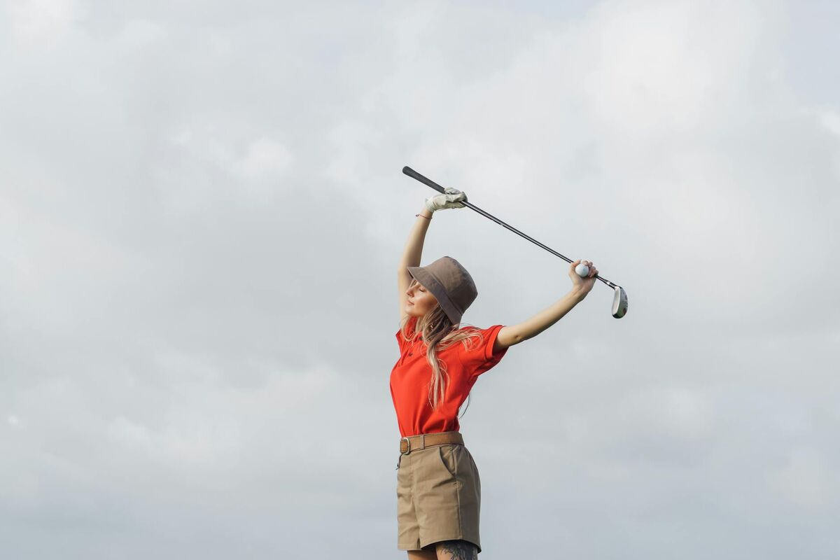 Golf Flexibility Stretching Routine for Senior Golfers Golfer stretching with a club to improve flexibility before playing