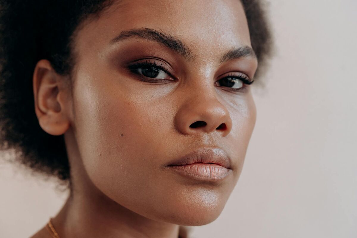 Close-up of woman with flawless, smooth skin and beautifully applied makeup